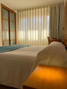 Postel nebo postele na pokoji v ubytování Hotel Tio Pepe