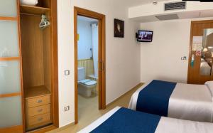 Postel nebo postele na pokoji v ubytování Hotel Tio Pepe