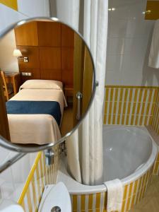 Postel nebo postele na pokoji v ubytování Hotel Tio Pepe