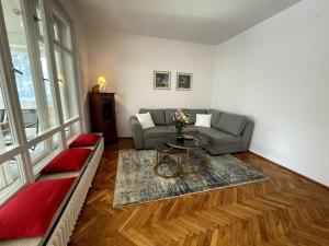 a living room with a couch and a table at Cracow Heart Apartment in Krakow