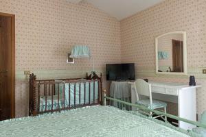 Postel nebo postele na pokoji v ubytování B&B Villa Dei Desideri