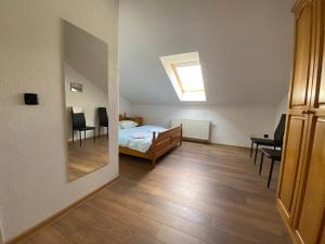a bedroom with a bed and a dining room at Motel Vujeva in Livno