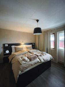 a bedroom with a large bed in a room at Villa with incredible view, 5 BR in Bergen