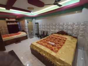 Postel nebo postele na pokoji v ubytování Hotel Paradise