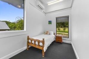 a bedroom with a bed and a window at Private Windsor House Studios Apartment in Brisbane