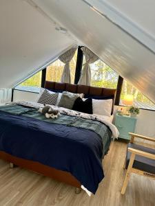 a bedroom with a bed in a tent at Apple house cafe in Ban Rong Fong