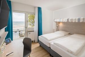 Postel nebo postele na pokoji v ubytování Stadthotel Eckernförde