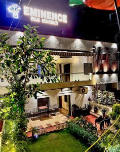 a living room with a fireplace in a building at EMINENCE - PALM RESIDENCY (1.5 KM FROM NAKKI LAKE) in Mount Ābu