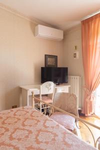 TV a/nebo společenská místnost v ubytování B&B Villa Dei Desideri