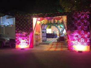 an entrance to a room decorated with christmas lights at BAGEECHA VILLA in Allahābād