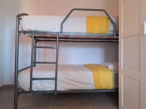 a bunk bed room with two bunk beds at roomwithview casa marco in Mojácar