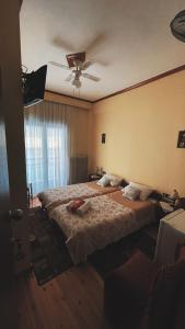 Rúm í herbergi á Olympiades Rooms Litóchoro