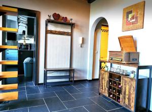 a kitchen with a tile floor and a counter with a microwave at Haushälfte mit Jakuzzi in Frankenberg in Frankenberg