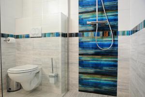 Koupelna v ubytování M Art Inn Apartman