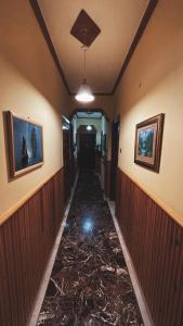 a hallway with a tile floor in a house at Olympiades Rooms Litóchoro in Litochoro