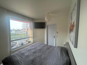 Ένα ή περισσότερα κρεβάτια σε δωμάτιο στο ApartHotel Asparuh Studio3