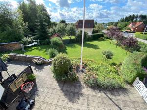 an aerial view of a garden with a park at Wonderful house & garden in Tommerup