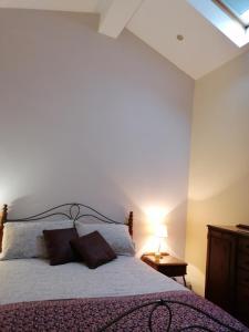 a bedroom with a large bed with a window at The Beeches in Newry