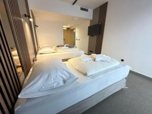 Letto o letti in una camera di Hotel Suljovic