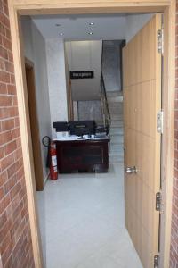 a view of a hallway with a staircase in a building at Duplex/ Appart hotel in El Biar