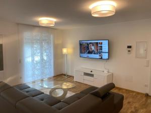 Televízia a/alebo spoločenská miestnosť v ubytovaní Quality See Apartments Reifnitz