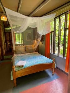 Letto o letti in una camera di Cocoa Cottage