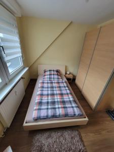 Ein Bett oder Betten in einem Zimmer der Unterkunft Ferienappartement Hexbachtal