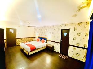 a bedroom with a bed in a room at The City Park hotel in Hyderabad