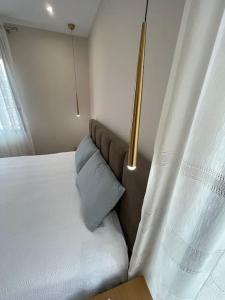 Postel nebo postele na pokoji v ubytování Melody Apartment in Korçë