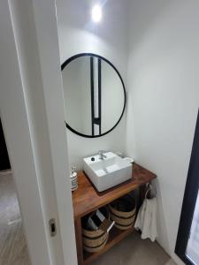 a bathroom with a sink and a mirror at las tunas in Funes