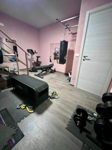 a room with a gym with a tv and weights at Hotel Bella Napoli ristorante & spa in Foggia