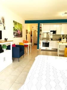 a living room with a kitchen and a dining room at Bayview Apartment 213 in Albufeira