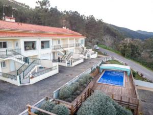 an aerial view of a house with a swimming pool at Casas Ponte D'Alge in Foz de Alge