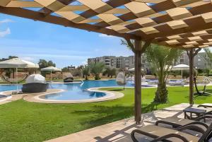 a view of a swimming pool at a resort at Thalassa Beach Resort in Vokolidha