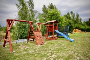 a group of playground equipment in a yard at Chatki u Agatki in Jezierzany