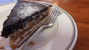 ein Stück Kuchen auf einem Teller mit einer Gabel in der Unterkunft Hotel Edelweiss in Erice