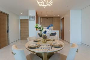 a dining room with a table and chairs at Arabian Nights - Oceanfront Luxurious Living at Atlantis The Royal in Dubai