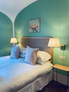 Postel nebo postele na pokoji v ubytování Terrazza Bellavista Suite