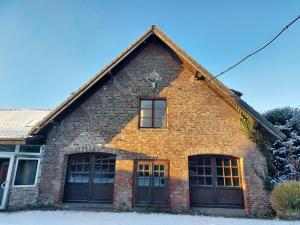 a brick building with two doors and a window at Gut Hansenhof in Düsseldorf