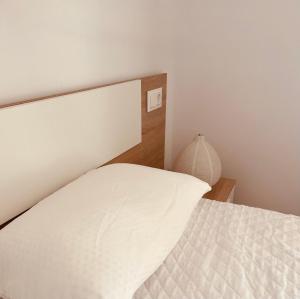 Posteľ alebo postele v izbe v ubytovaní Precioso apartamento con chimenea y vistas al mar