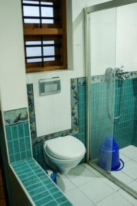 a bathroom with a toilet and a shower at Silver Homes Homestay in Alwaye