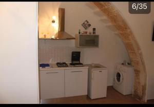 A kitchen or kitchenette at Residence Emozioni Ortigia