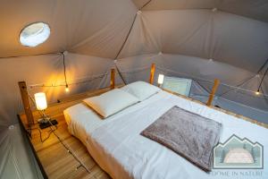 a bedroom with a bed in a tent at Dome in Nature in Larnaka