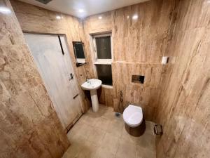 a bathroom with a toilet and a sink at Trekkers Home in Kathmandu