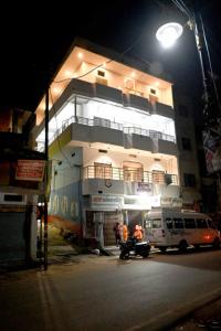 a building with a van parked in front of it at night at Hotel Bhagwaan Das In Varanasi in Varanasi