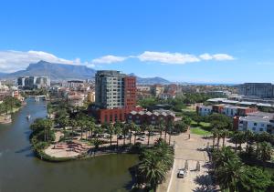 arial view of a city with a bridge over a river at Cape Town Luxury Stays Knightsbridge Luxury Apartment Century City in Cape Town