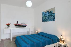 Ліжко або ліжка в номері Villa vue mer Mirleft - ménage et Cuisinière à mi-temps