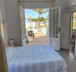 Ліжко або ліжка в номері Villa vue mer Mirleft - ménage et Cuisinière à mi-temps