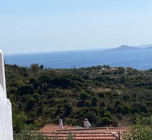 a view of the ocean from a house at Two sisters in Alonnisos Old Town +5 photos