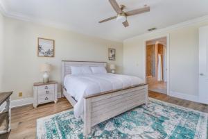 a bedroom with a bed and a ceiling fan at St James Bay Golf & Pickleball Resort in Big Blackjack Landing